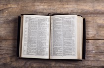 graphicstock-opened-bible-on-a-wooden-desk-background_HC9Nsrp-W